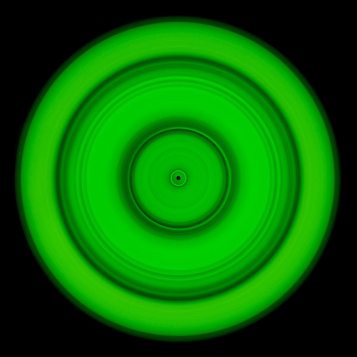 Six concentric bands of lime green light radiating outward from small dark center void, with soft outer edges fading to black