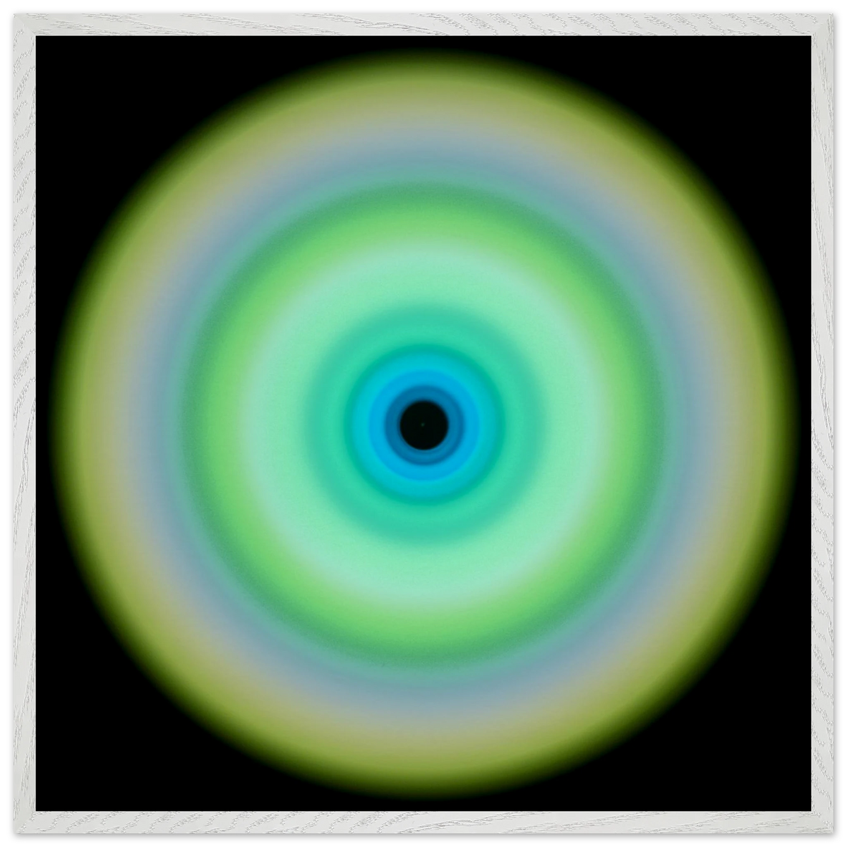 A circular form with concentric rings transitioning from pale yellow-green on the outer edge through lime green and aqua to cobalt blue around a small dark center.