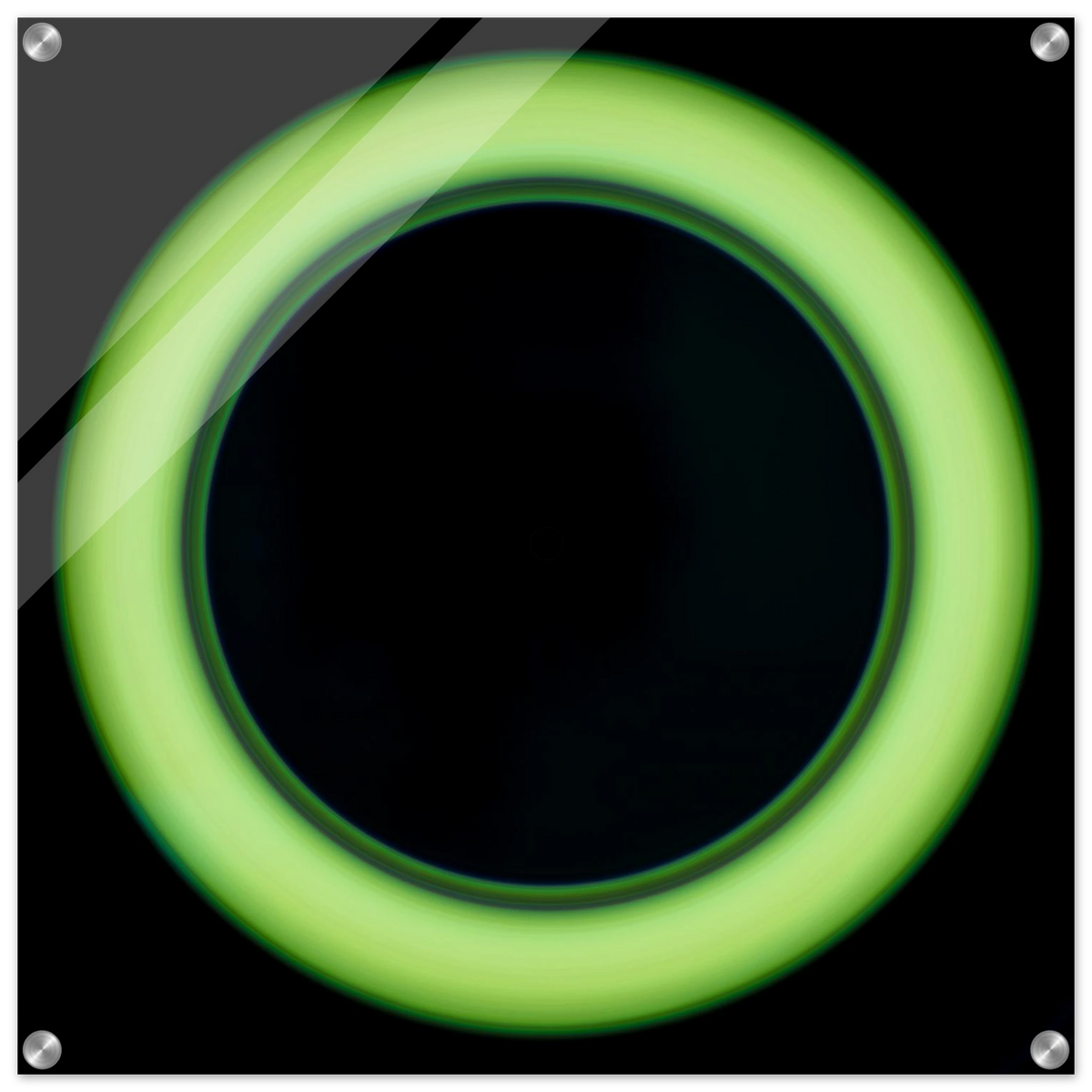 A bright lime green circular ring shape with a large black center and soft glowing edges against a black background.