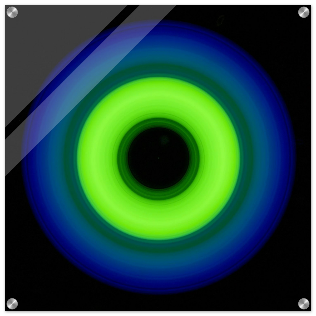 A circular ring shape with bright lime green center transitioning through teal to cobalt blue outer edge with black center void.