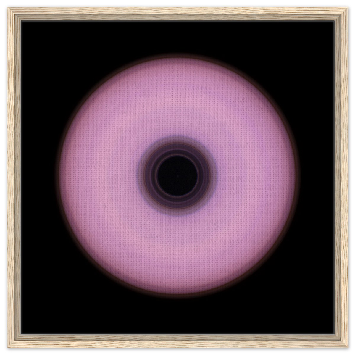 A circular ring with soft pink outer area and concentric bands in the center transitioning from deep violet to black.