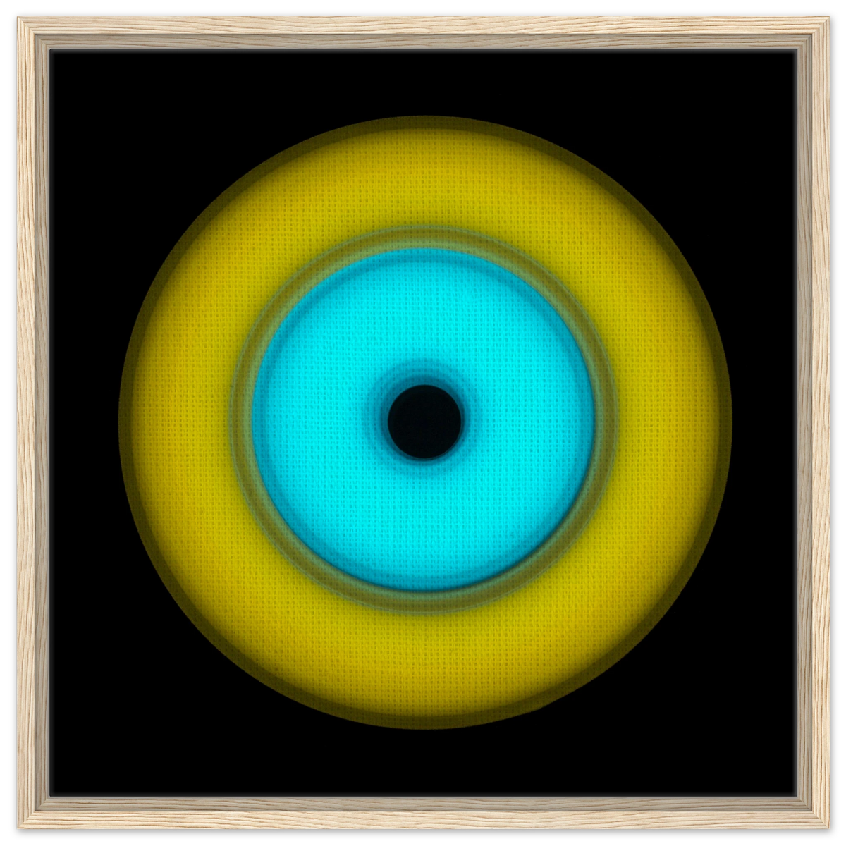 A circular aperture shape with bright yellow outer ring, electric cyan inner circle, and small black center hole against a black background.