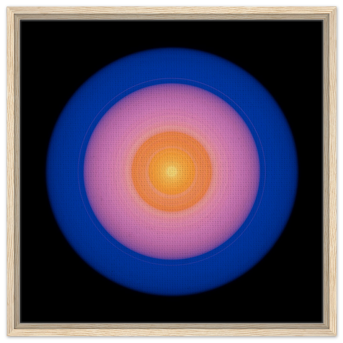 A circular disc with concentric color zones from bright yellow center through orange and coral pink to deep blue outer edge on black background.